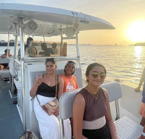 Guests heading back at sunset on a full-day private charter in Nassau