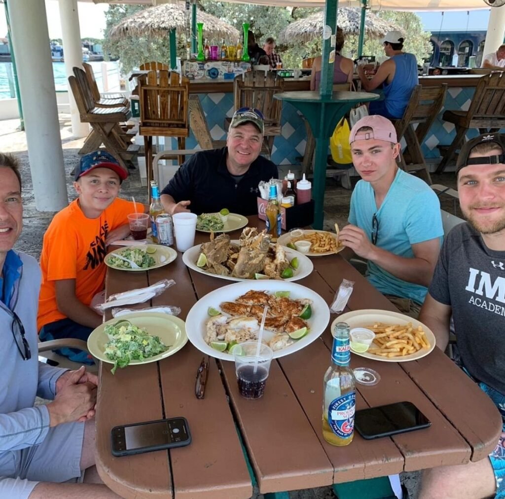 Guests enjoying a seafood lunch after their fishing charter in Nassau