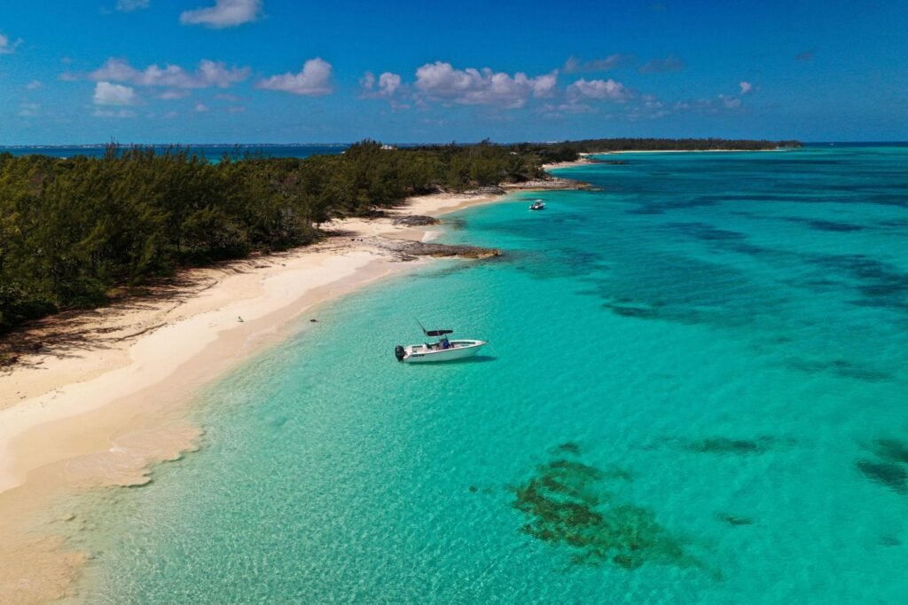 Aerial view of Rose Island’s white sand beach and turquoise shallows