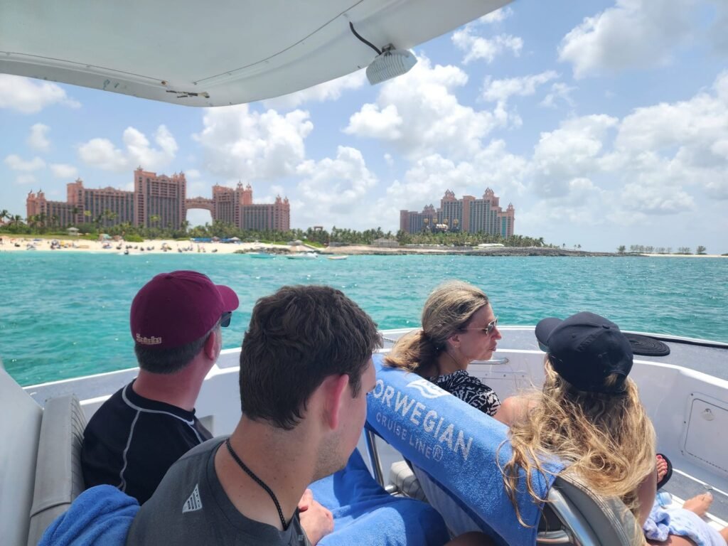 Guests cruising past Paradise Island and Atlantis on a private boat
