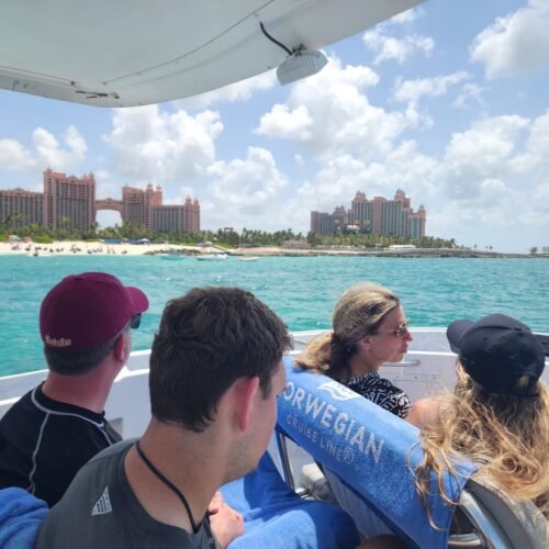 Guests cruising past Paradise Island and Atlantis on a private boat