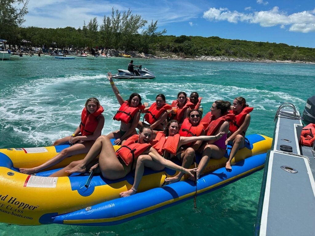 Guests riding a banana boat on a private island tour in the Bahamas